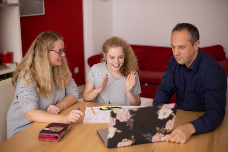 Family discussing NDIS plan management options
