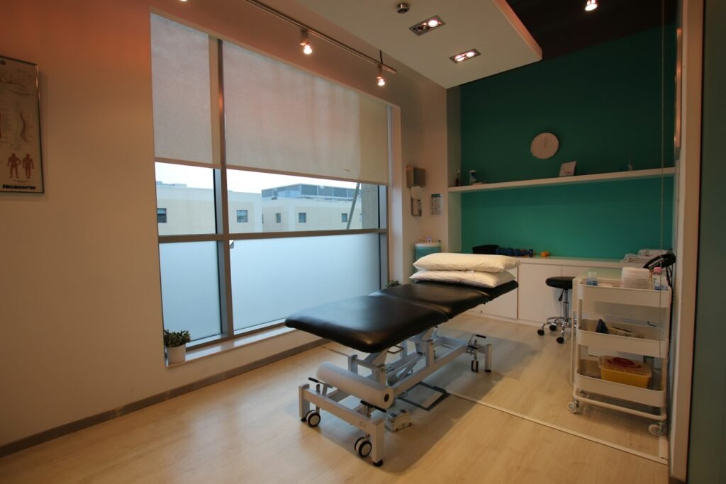 An empty allied health treatment room with a therapy bed, representing NDIS therapeutic supports